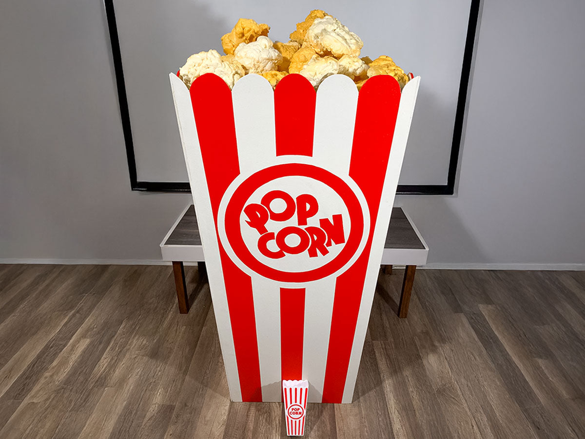 red and white giant popcorn box display prop for movie theater made of wood