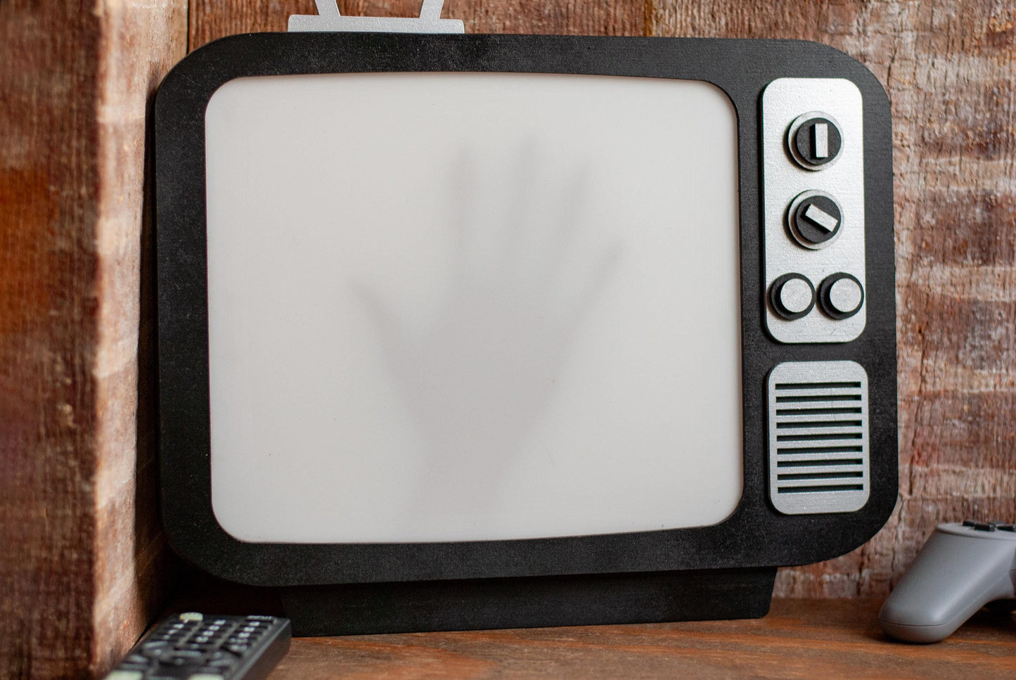front view of shadow box Retro TV LED with creepy hand shadow for Horror Movie Fans, Gamers, Bedroom or movie room - wood and acrylic - light up wall art