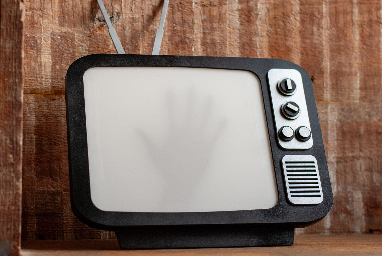 side view of shadow box Retro TV LED with creepy hand shadow for Horror Movie Fans, Gamers, Bedroom or movie room - wood and acrylic - light up wall art