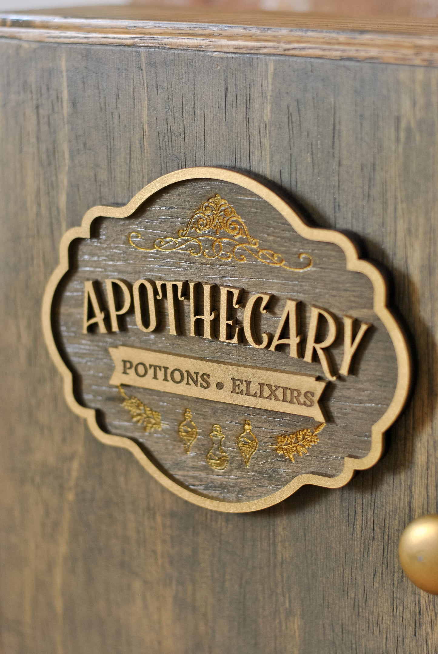 Close-up view of rustic apothecary box with wooden sign that reads 'Apothecary Potions & Elixirs'.