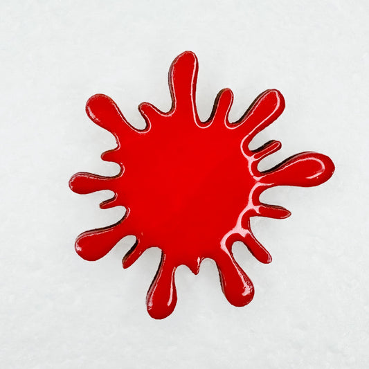 red blood splatter designed lapel pin for bookbag, shirts, or purse on white background