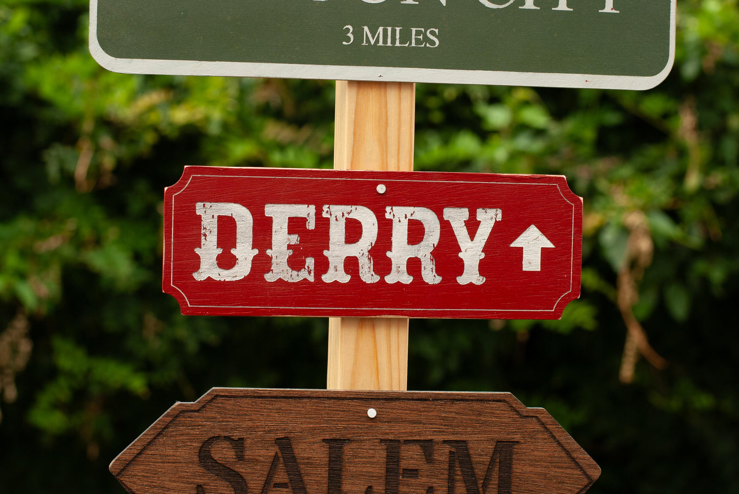 Close up view of Derry Horror Decor Directional Signs with Post and stand outdoor Halloween decoration with six horror destination signs - Movie Room Decor