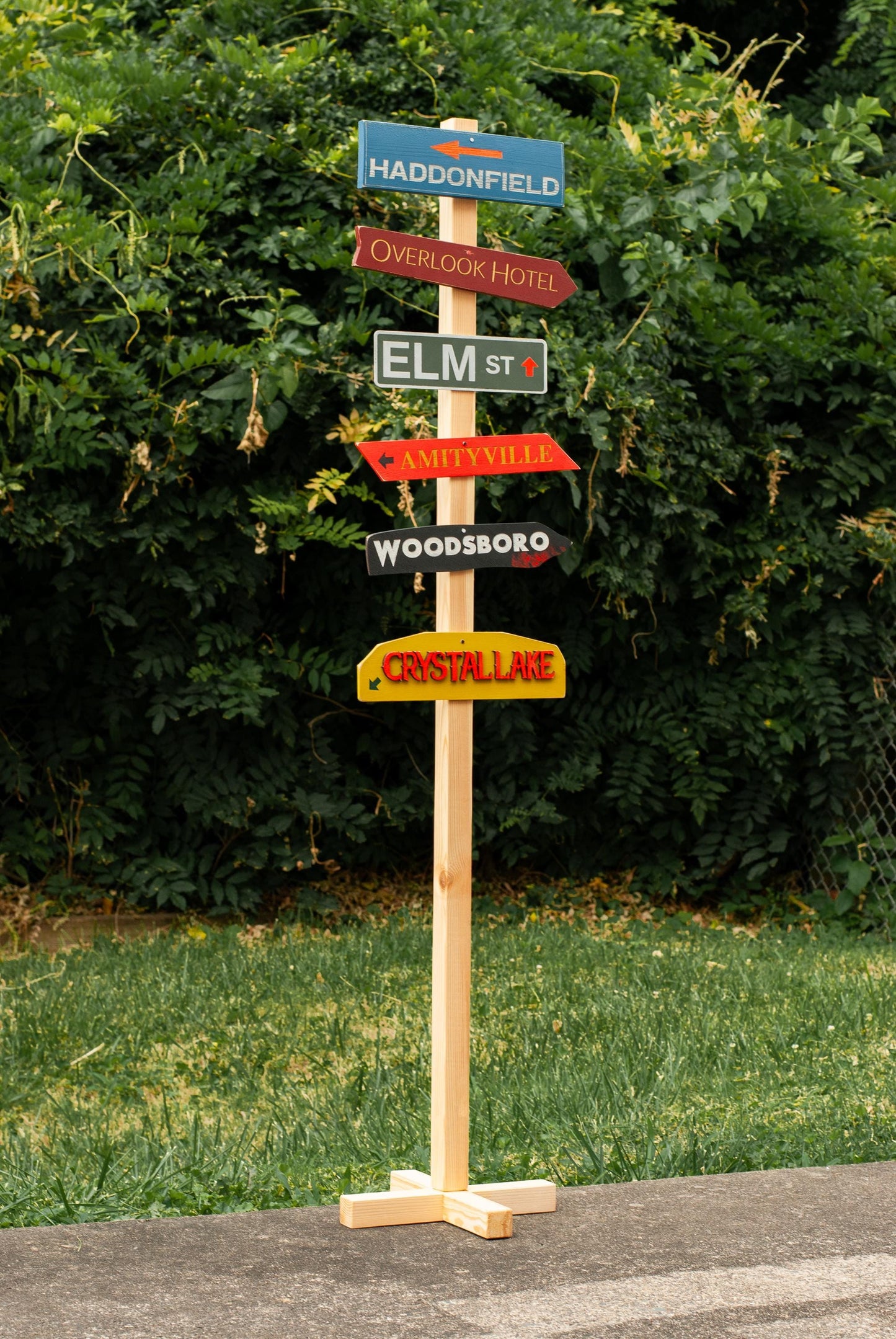 Full view of customizable Horror Decor Directional Signs with Post and stand outdoor Halloween decoration with six horror destination signs - Movie Room Decor