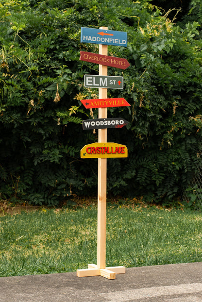 Full view of customizable Horror Decor Directional Signs with Post and stand outdoor Halloween decoration with six horror destination signs - Movie Room Decor