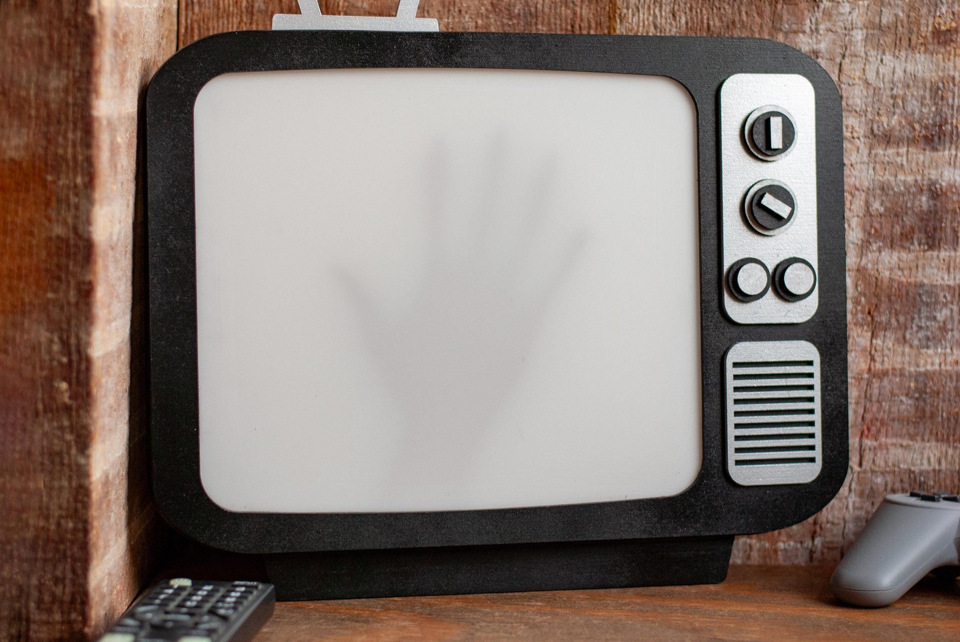 front view of shadow box Retro TV LED with creepy hand shadow for Horror Movie Fans, Gamers, Bedroom or movie room - wood and acrylic - light up wall art