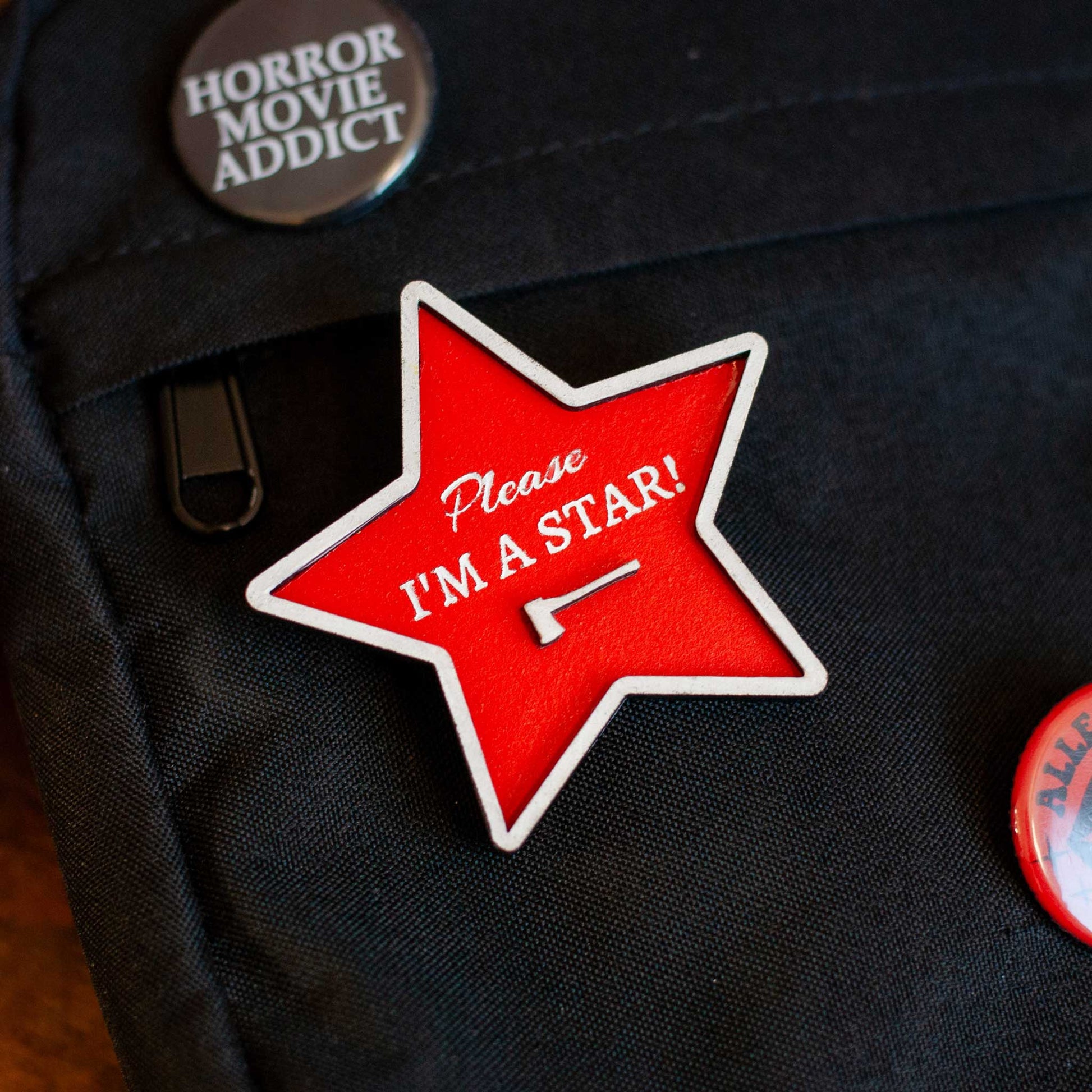 front view of wooden please, I'm a star red brooch pin for bag, shirt, purse, or tote, pearl horror movie inspired pin, gift for horror movie fans
