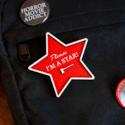 front view of wooden please, I'm a star red brooch pin for bag, shirt, purse, or tote, pearl horror movie inspired pin, gift for horror movie fans