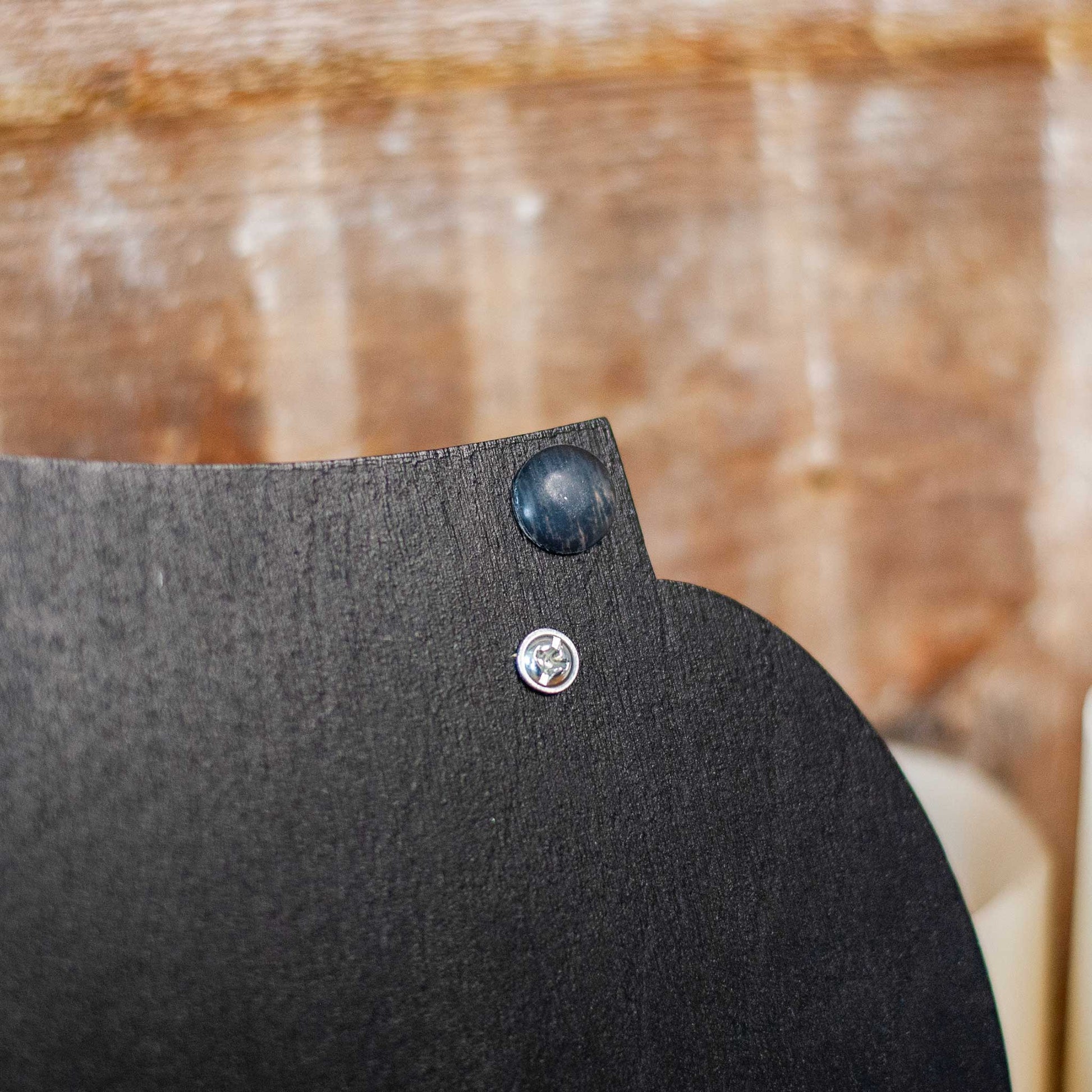 Close up of back of black decorative wooden and resin tray