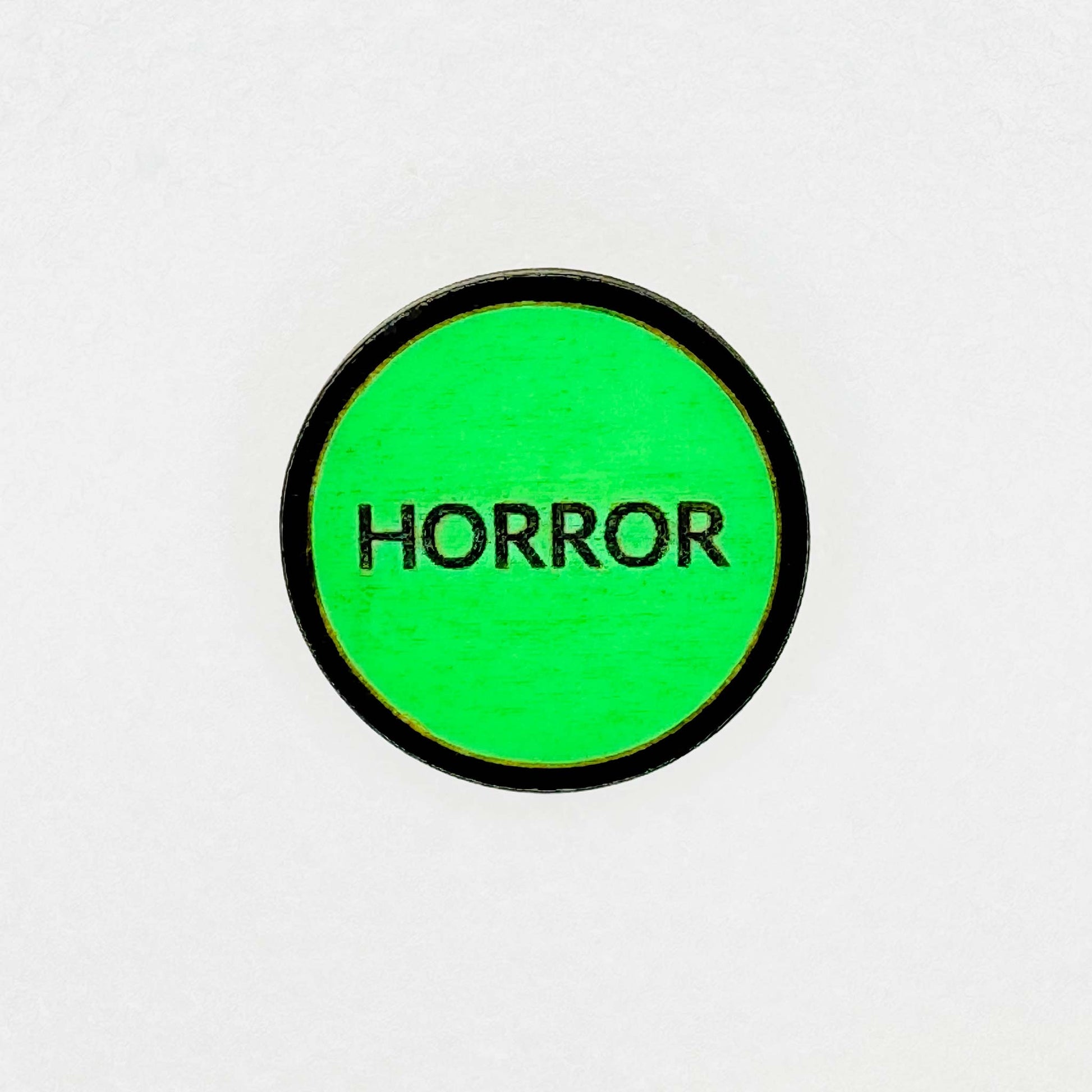 Retro vintage green VHS horror label with 'HORROR' text on a white background