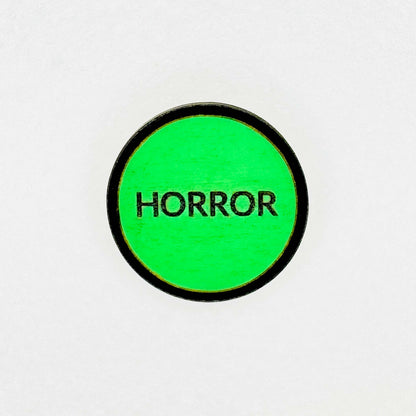Retro vintage green VHS horror label with 'HORROR' text on a white background